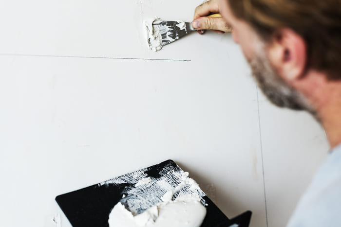 applying gypsum plaster